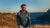 Handsome young man in Merino wool sports clothing long sleeve top standing outside. 