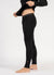 Person wearing black leggings with a visible brand logo on a white background