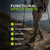 Front view of hiker wearing green ribbed Merino hiking socks with hiking boots, standing on a rock overlooking mountains and lake.