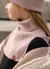 Girl standing outdoors and wearing dusty pink neck turtle dickie
