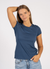 Woman wearing a blue t-shirt and jeans on a white background